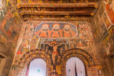 GONDAR, ETHIOPIA - MARCH 13, 2019: Colorfuly decorated interior of Debre Birhan (Berhan) Selassie church in Gondar, Ethiopia. clipart
