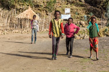 LALIBELA, ETHIOPIA - MARCH 30, 2019: Children on a rural road near Lalibela, Ethiopia