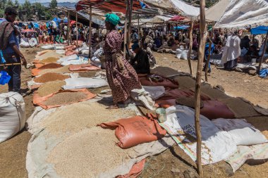 LALIBELA, ETHIOPIA - MARCH 30, 2019: Grains sellers at the Saturday market in Lalibela, Ethiopia