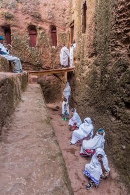 LALIBELA, ETHIOPIA - MARCH 31, 2019: Group of worshippers during the Sunday service at  rock-hewn churches in Lalibela, Ethiopia