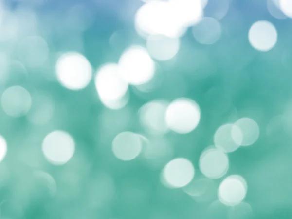 Green christmas background with bokeh lights — Stock Photo, Image