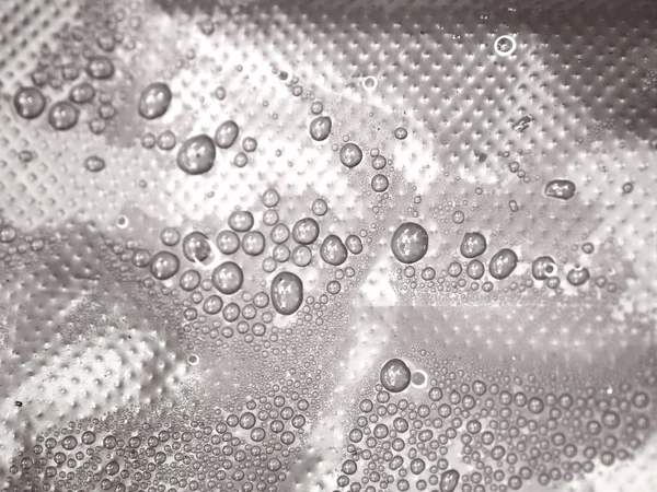 Condensation and drops on a Plastic with touches of color — Stock Photo, Image
