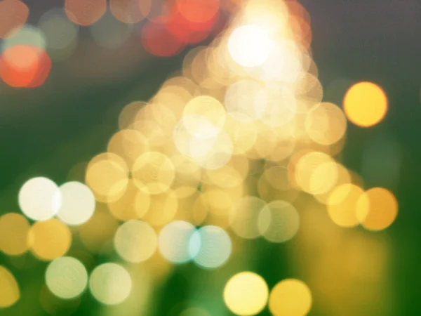 Yellow christmas background with bokeh lights — Stock Photo, Image