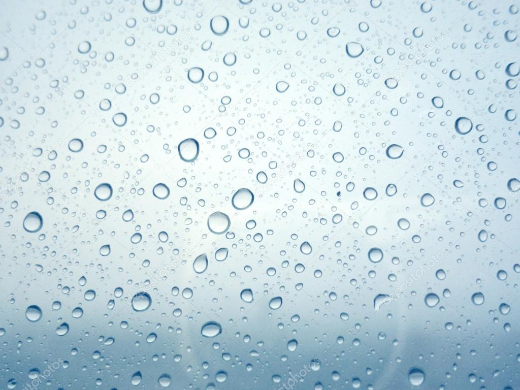 Close-up of water drops on glass surface as background