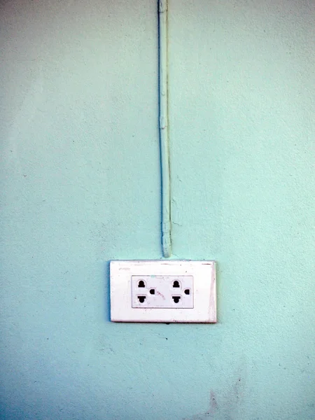 Toma de corriente en una pared —  Fotos de Stock