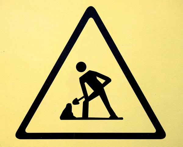 Yapım aşamasında (altında inşaat simgesi altında inşaat simgesi altında adam inşaat yol işareti) — Stok fotoğraf