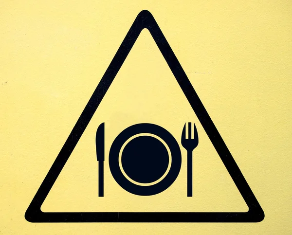 Triangular road sign with fork and knife — Stock Photo, Image
