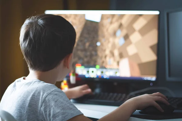 Teenager playing Minecraft multiplayer online game (MMO Stock Photo - Alamy