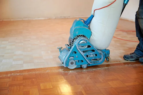 Worker Polishing Parquet Floor Grinding Machine Stock Image