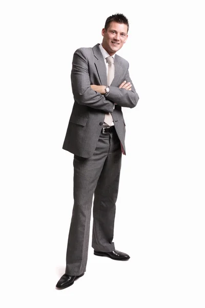 Young handsome businessman standing alone — Stock Photo, Image
