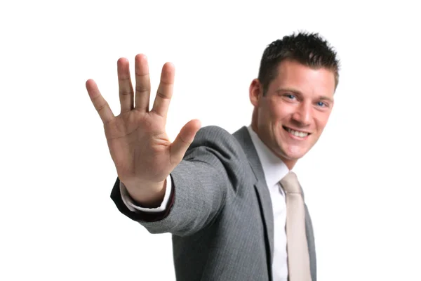 Young businessman showing an open palm — Stock Photo, Image