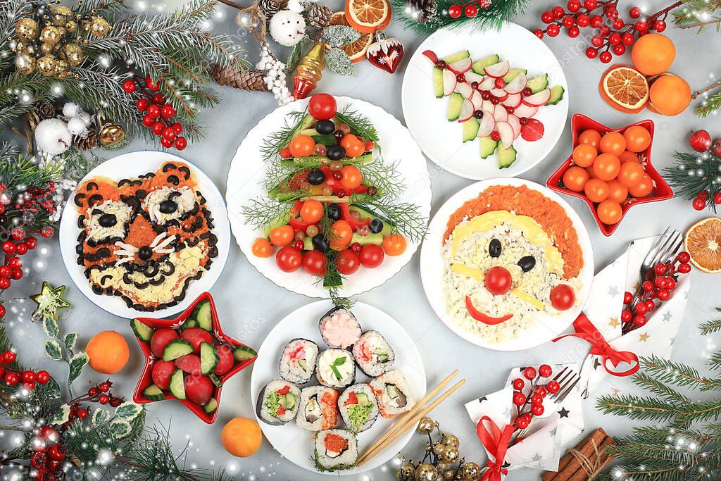 Christmas new year dishes, traditional festive salad with tiger and santa claus, symbol of the year, edible veggie trees made of vegetables and fruits, food design idea, fir branches and decorations ,, flat lay