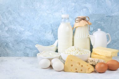 Assorted fresh dairy products, healthy breakfast with ingredients, natural nutrition concept, maintaining healthy intestinal microflora, diet food, rustic table, selective approach