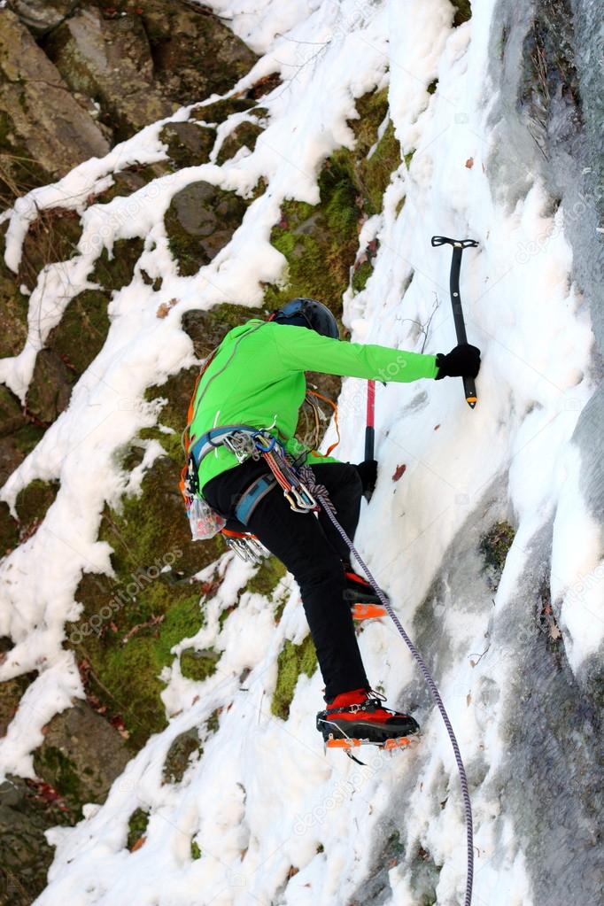 mountaineer on ice wall