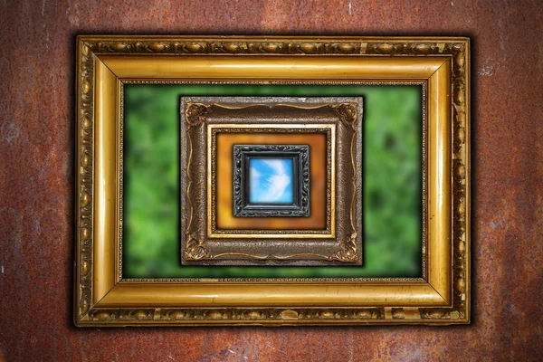 Abstract view with frames on rusty industrial wall — Stock Photo, Image