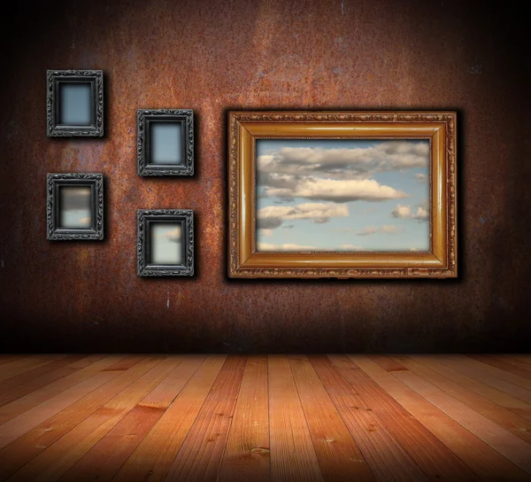Architectural backdrop with frames on grunge wall — Stock Photo, Image