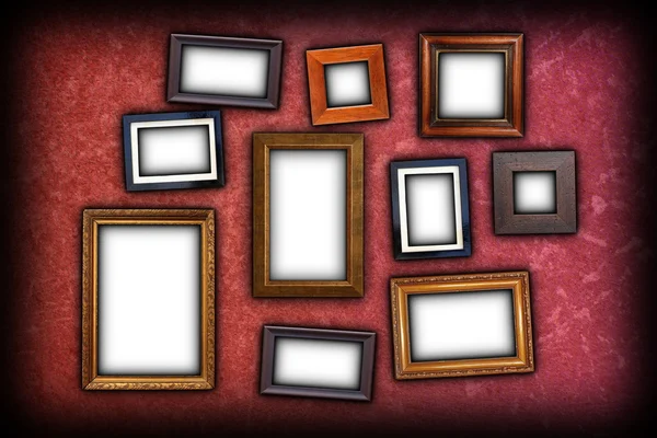 Red scratched wall with frames — Stock Photo, Image