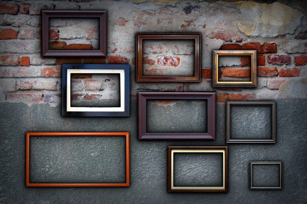 Frames on cracked ancient wall — Stock Photo, Image