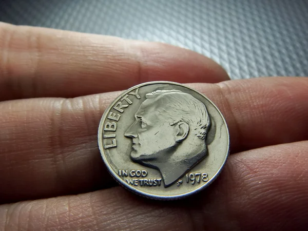 US Dollar Coins on finger — Stock Photo, Image