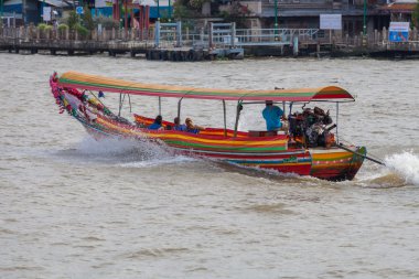 BANGKOK, THAILAND - NOVEMBER 10 : typical long tail boat down Ch clipart