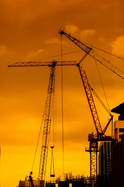 Mobile crane operating, silhouettes — Stock Photo, Image