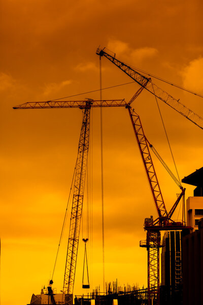 mobile crane operating, silhouettes