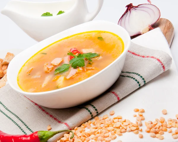 Peas soup in a white porcelain plate — Stock Photo, Image