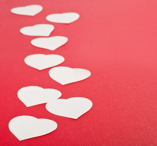 Tarjeta de San Valentín con corazones rojos y llave — Foto de Stock