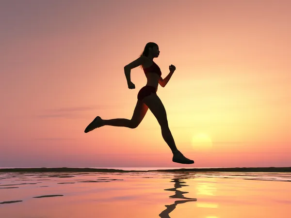 Woman running on the beach Royalty Free Stock Photos