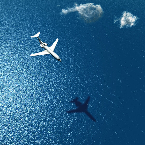 airplane flies over a sea