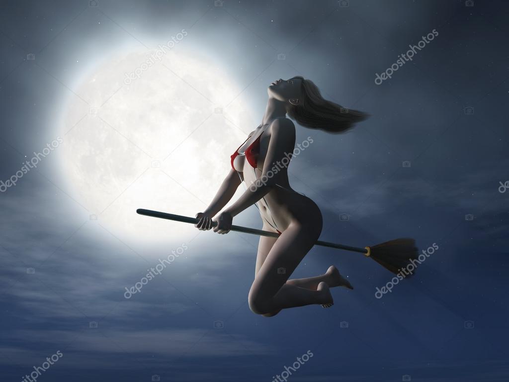 Witch flaying on broom at halloween night