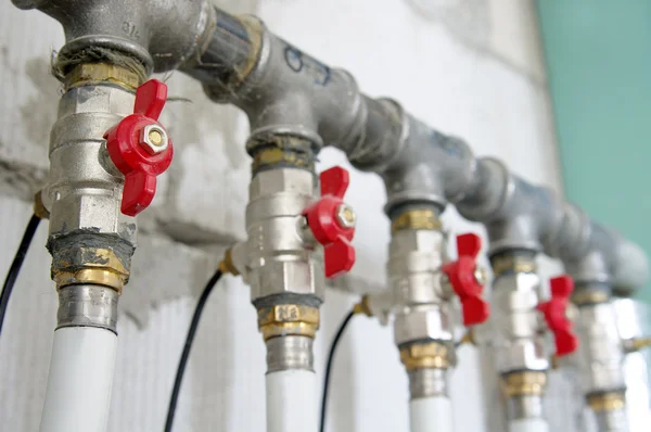 Pipes and valves for warm watter — Stock Photo, Image