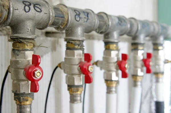 Pipes and valves for warm watter — Stock Photo, Image