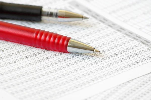 Ballpoint Pens on table with numbers — Stock Photo, Image