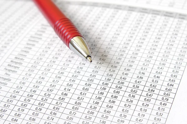 Ballpoint Pen on table with numbers — Stock Photo, Image