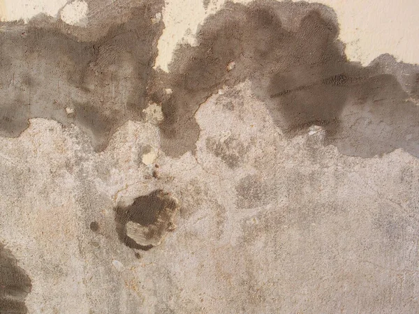 Repaired the old grunge wall with cement powder for building house. Wall Painting Preparation at home