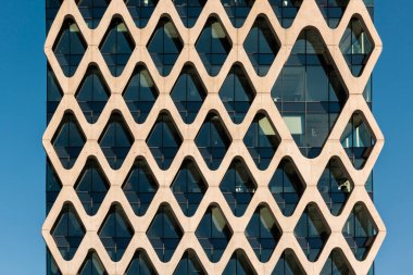 Modern abstract facade of an office building. Details of modern architecture.