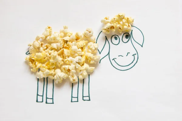 The Painted Sheep and popcorn. — Stock Photo, Image