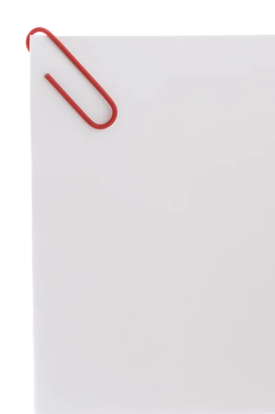 Kleurrijke paperclip op wit papier — Stockfoto