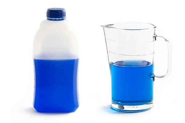 Liquid screenwash in plastic bottle and glass jug — Stock Photo, Image