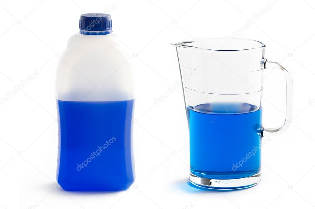 Liquid screenwash in plastic bottle and glass jug