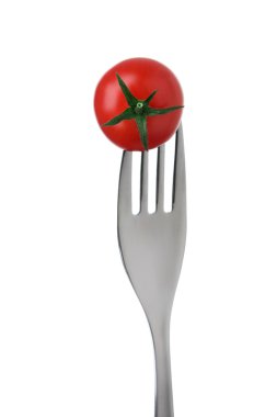 domates üzerinde beyaz bir çatalı