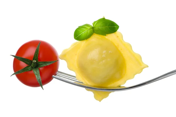 Ravioli pasta tomato and basil on fork against white background — Stock Photo, Image