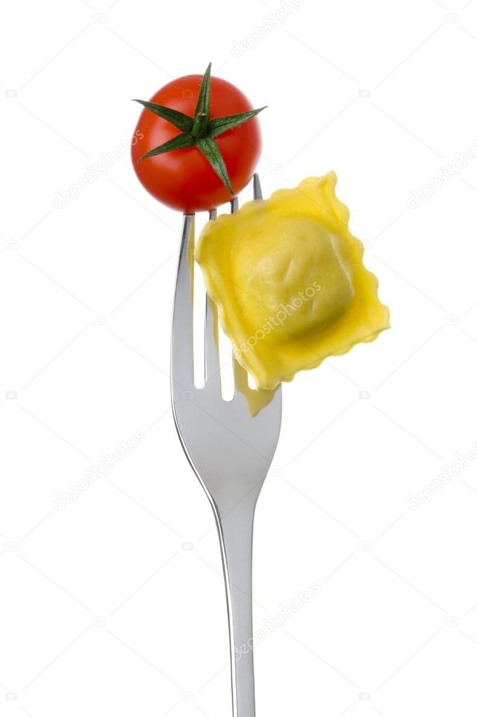 Ravioli and tomato on a fork against a white background