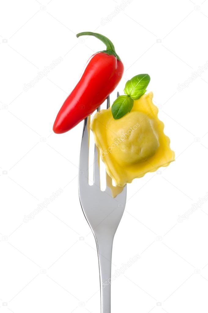 Ravioli basil and chili pepper on a fork