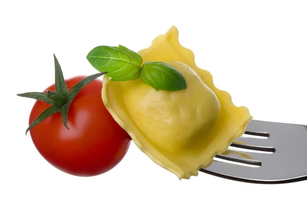 Ravioli pasta tomato and basil on fork against white background — Stock Photo, Image