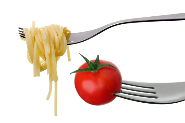 Спагетті і помідор на виделках ізольовані — стокове фото