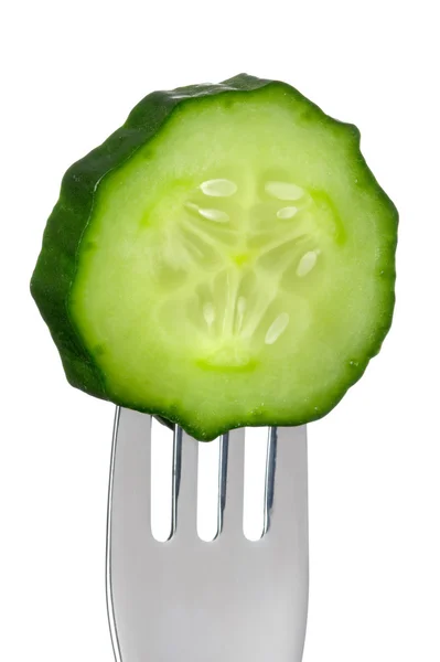 Cucumber slice on a fork isolated — Stock Photo, Image