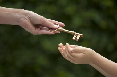 adult hands key to child clipart