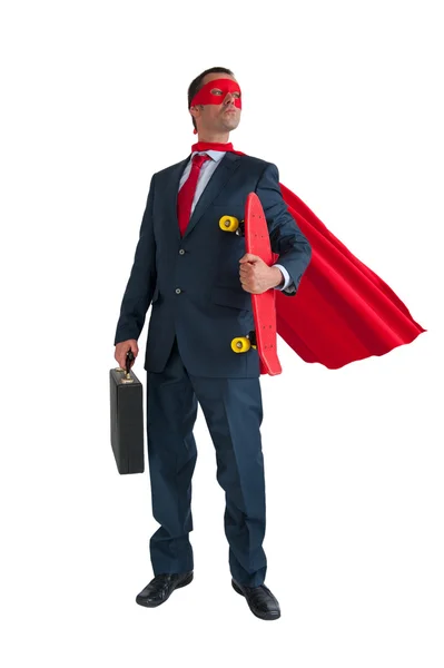 Superhero businessman holding a skateboard isolated — Stock Photo, Image